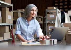 mature-female-seller-using-computer-checking-ecomm-2021-09-02-07-22-57-utc