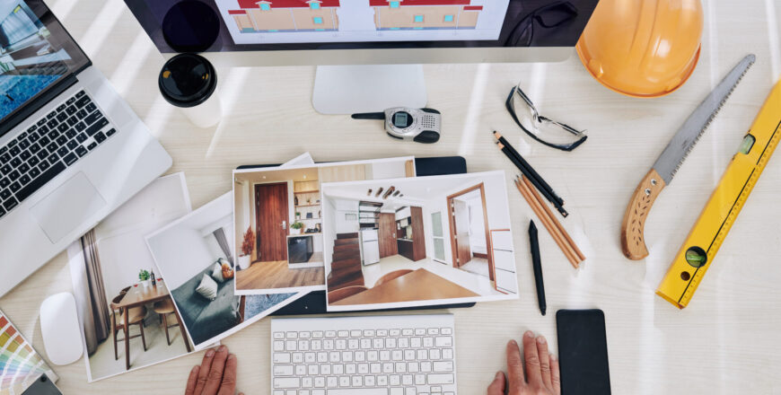 Interior designer looking at printed photos