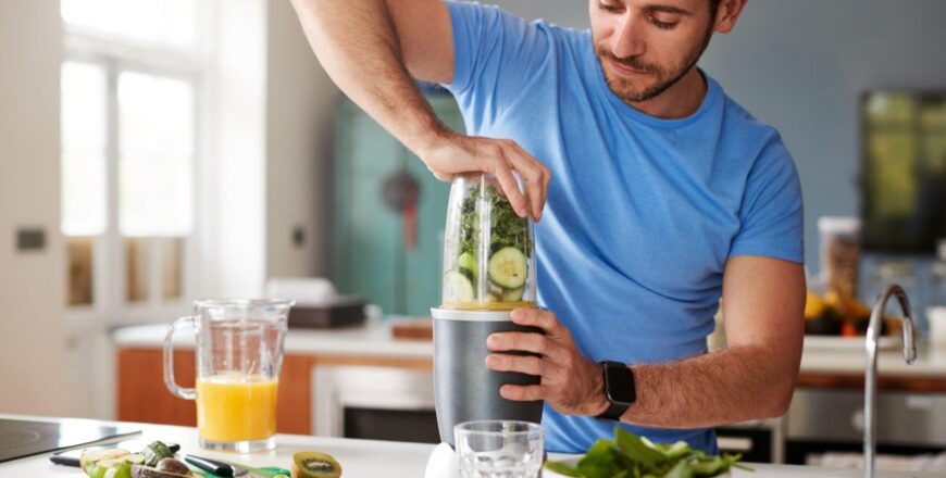 man-making-healthy-juice-drink-with-fresh-ingredie-2022-02-08-22-39-24-utc