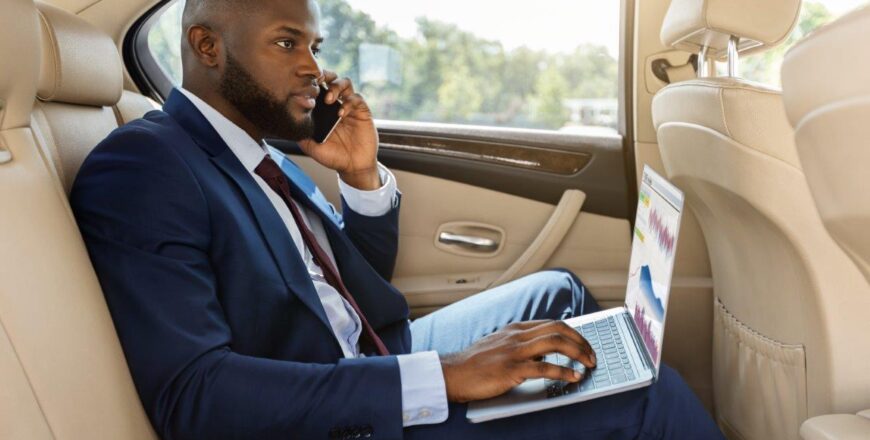 rich-afro-american-businessman-working-in-car-2022-12-16-07-24-47-utc